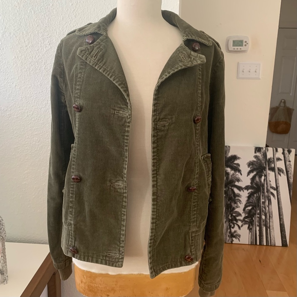 XDYE double-breasted olive green jacket with brown wooden style buttons.